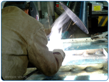 Suction arm for drawing dangerous welding smoke without disrupting workflow